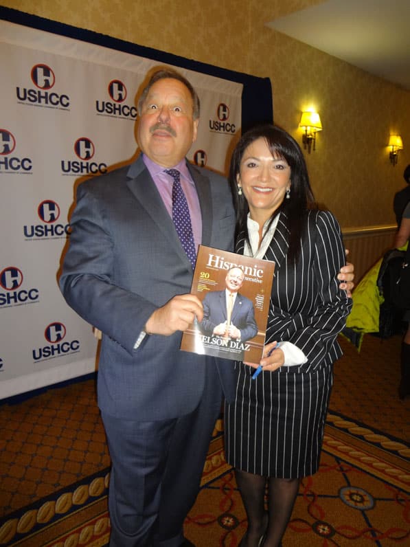 Nina Vaca, Chairman and CEO of PInnacle Technical Resources, poses with HE cover star Nelson Diaz. 