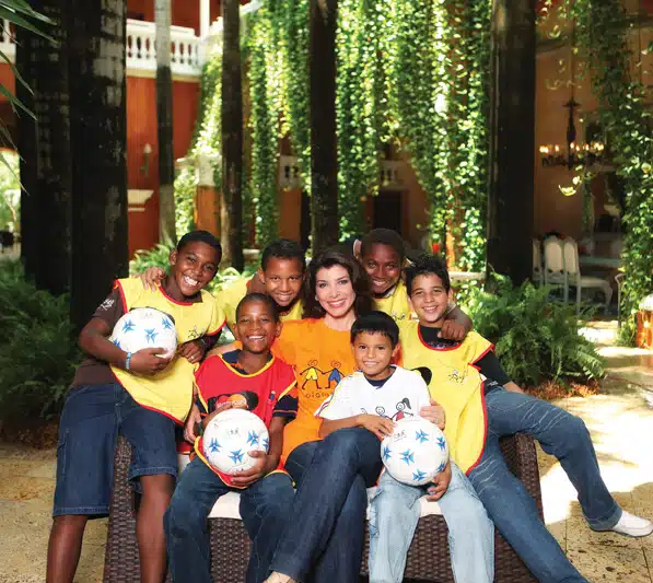 Janiot with members of the Colombianitos Goals For a Better Life soccer program in Cartagena, Colombia. Ninety-eight percent of the children in this program are enrolled in and attending school. Colombianitos benefits more than 4,300 children.