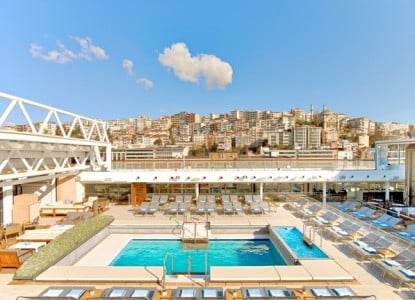 The Main Pool aboard the Viking Star ocean vessel has a retractable roof designed for guests to enjoy a swim anytime, no matter the weather.