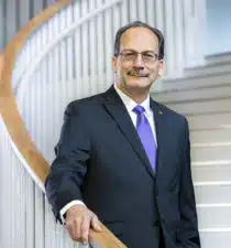 Havidán Rodríguez, President, University at Albany - portrait on stairs