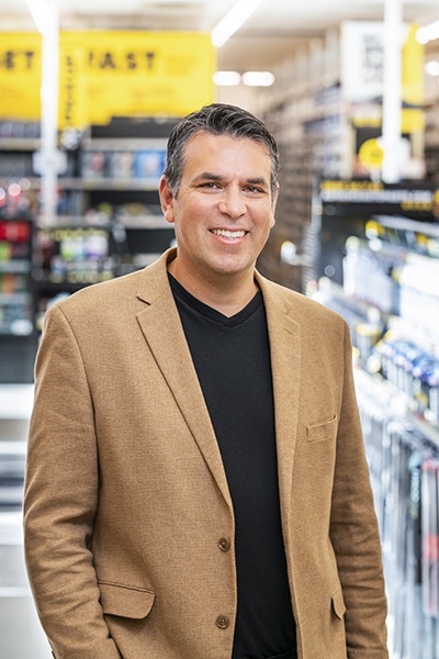 Adolfo Rodriguez, SVP of IT Transformation, Advance Auto Parts_portrait brown jacket