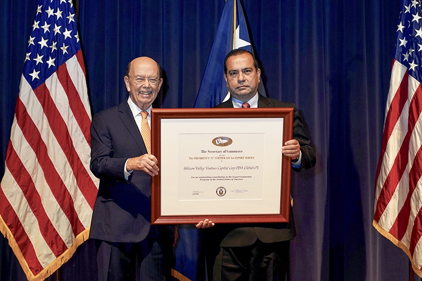 Sergio Retamal accepts President’s “E” Award from Secretary of Commerce Wilbur Ross