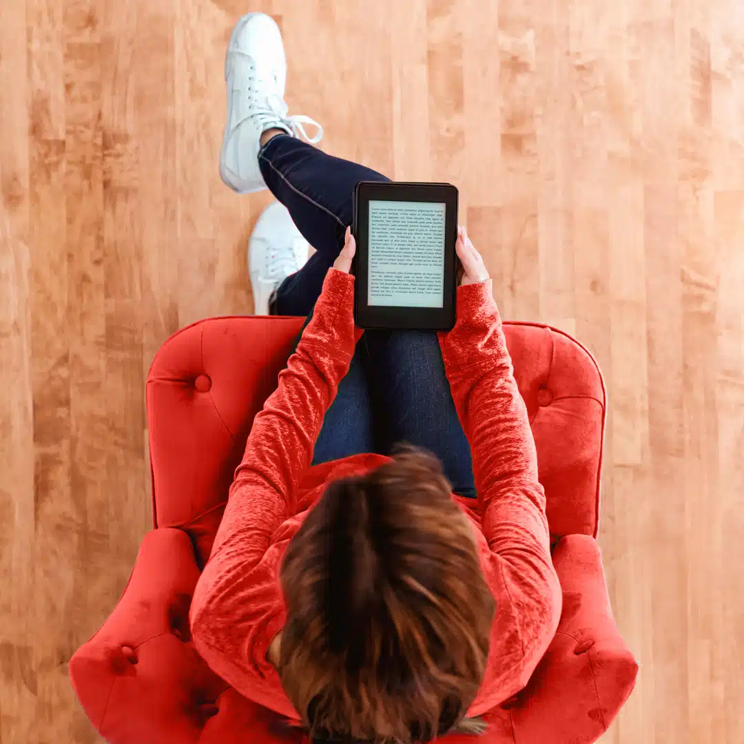 Woman reading a from an e-book tablet