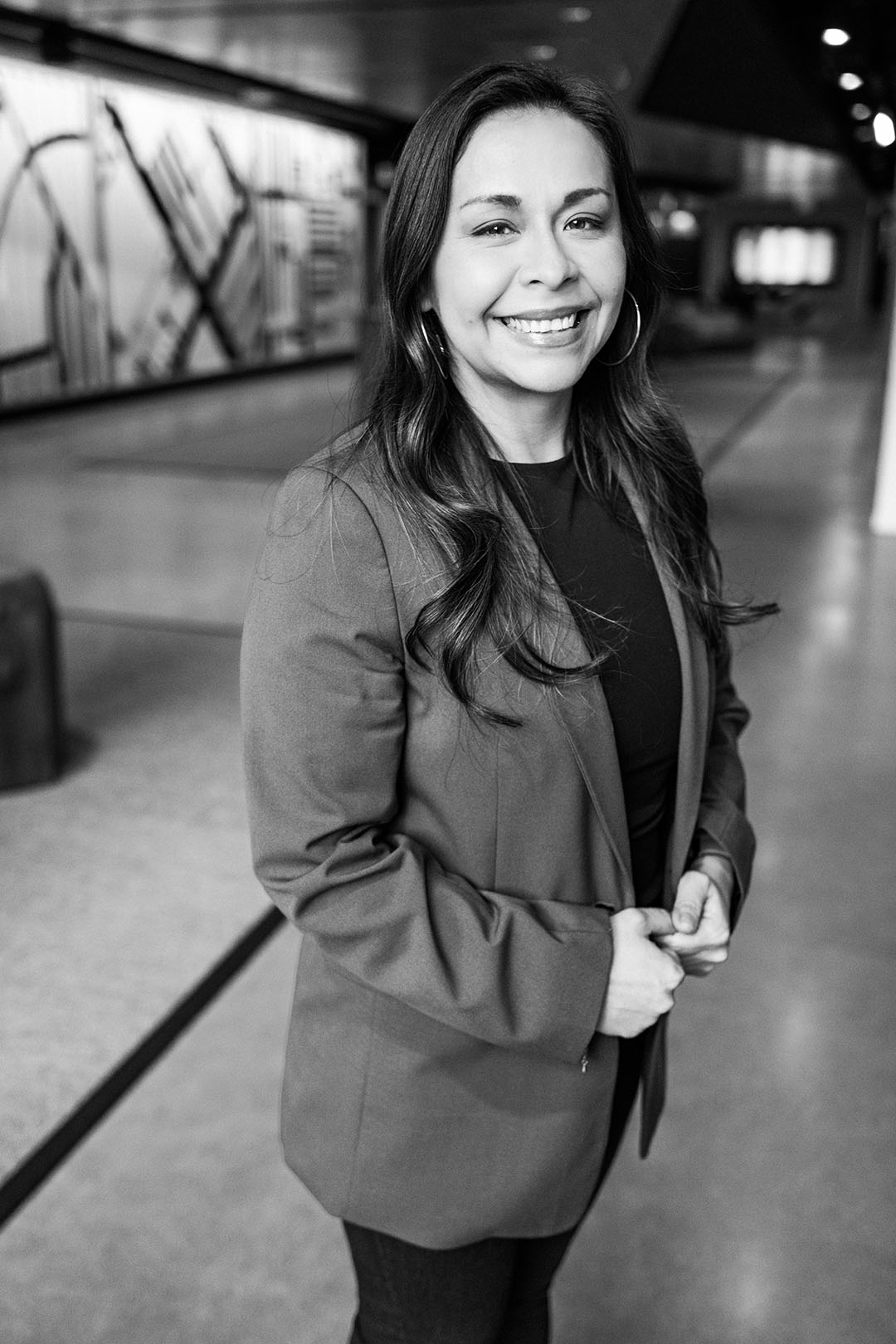 A black-and-white portrait of of Deanna Hernandez, field marketing officer at McDonald's.